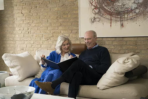 man-and-woman-sitting-on-couch